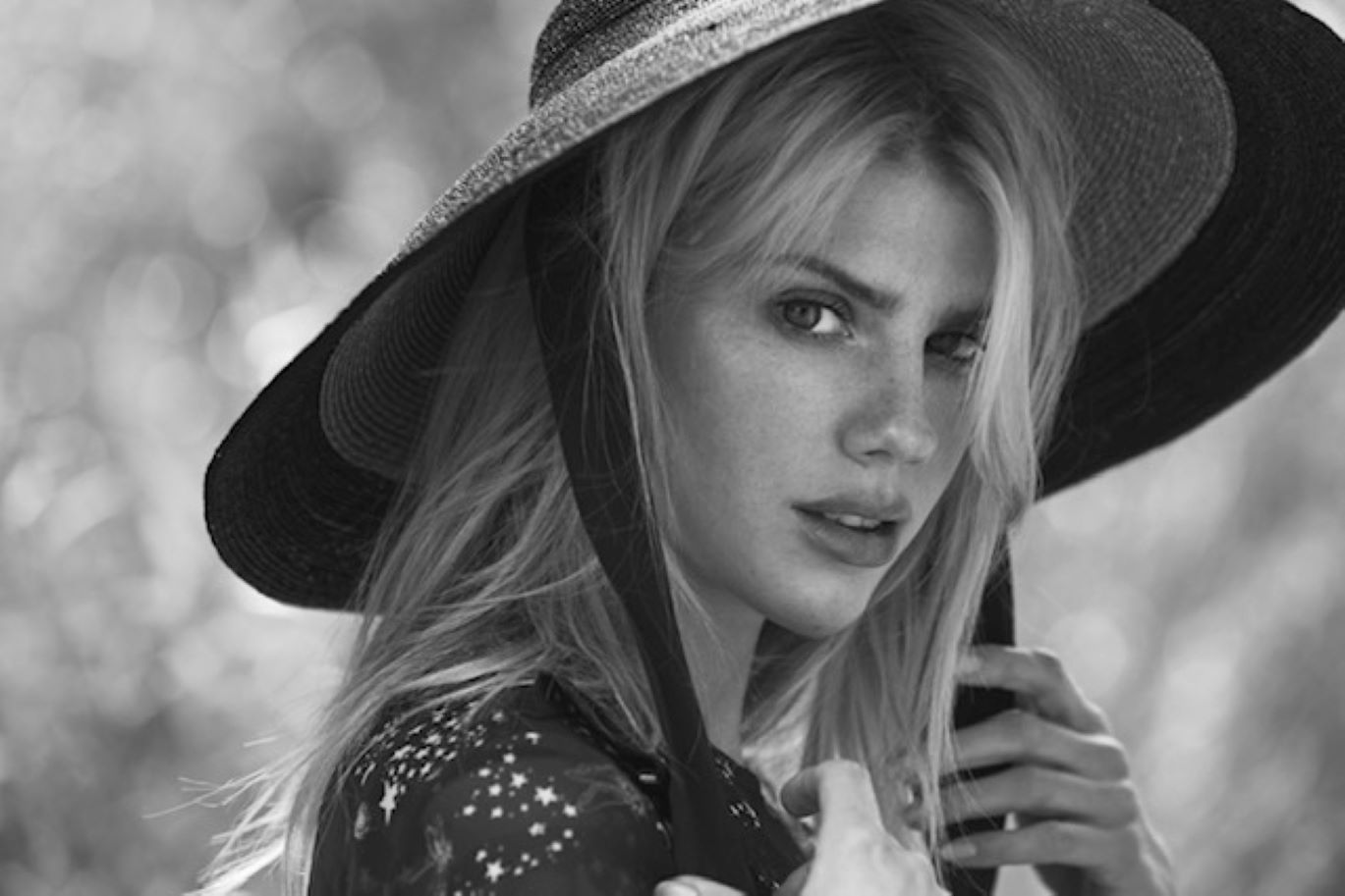 Charlotte McKinney Slips On a Sporty Wetsuit Over Her Green Bikini